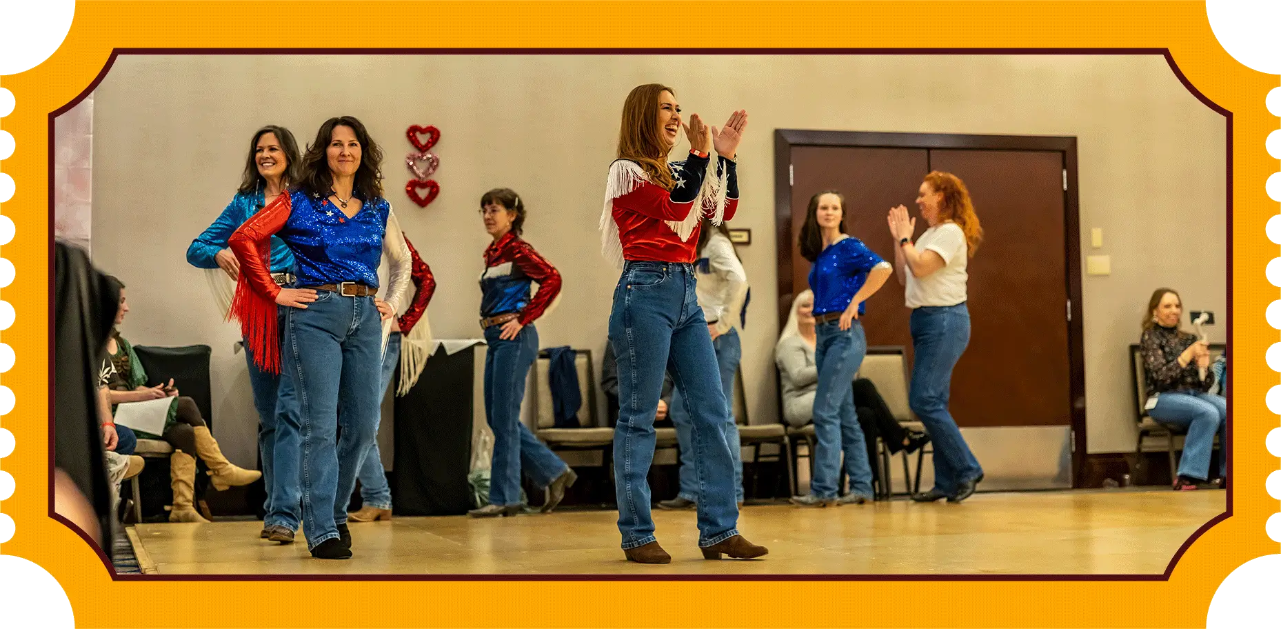 A young girl singing with a group in casual attire indoors.